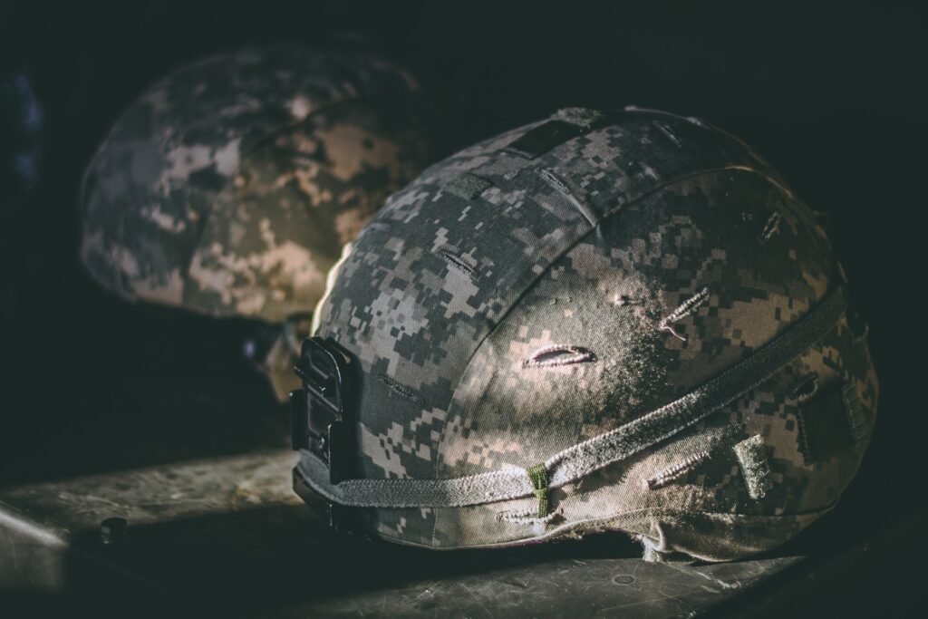 Military helmets symbolizing leadership styles in the army.